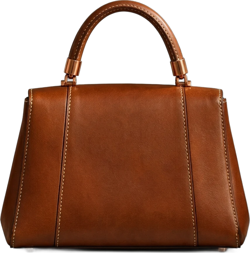 AGES handbag, back: cognac leather panels with contrast saddle stitching and copper feet